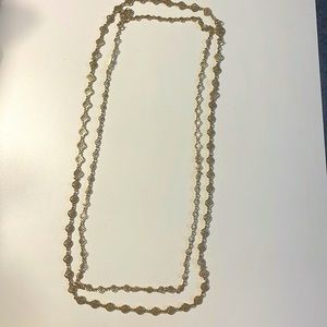 Sella and dot double gold necklace.